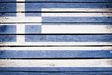 greece, greek  flag painted on old wood plank backgroundの写真素材