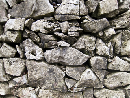 ancient stone wall texture backgroundの写真素材