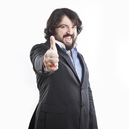 portrait of positive businessman with beard, thumb upの写真素材