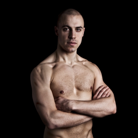 Handsome muscular guy on black backgroundの写真素材