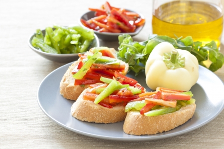 Crostini with red and green pepperの写真素材