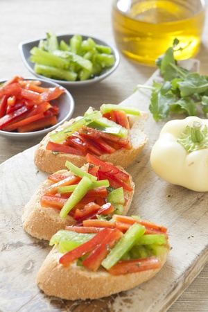 Crostini with red and green pepperの写真素材