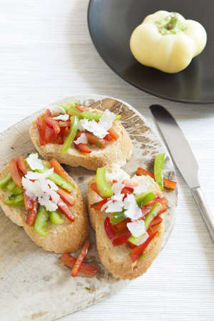 Crostini with red and green pepperの写真素材
