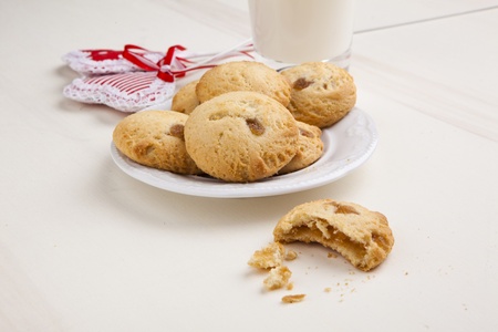 delicious apple biscuits on wooden table with heart decorationsの写真素材