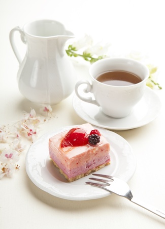 beautiful pink berries pastry, little cake with teaの写真素材