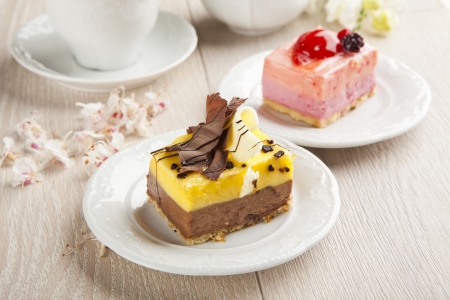 beautiful pastry, little colorful sweet cakes with teaの写真素材