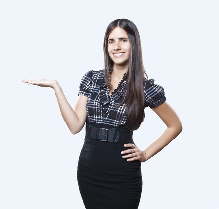 Happy smiling young beautiful business woman showing something or copyspase for product or sign text, isolated over white backgroundの写真素材