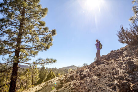 woman hiking up the mountainの写真素材