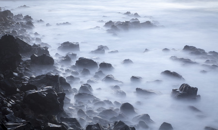 Seascape, waves in a long exposure, sea and rocks in the evening,の写真素材
