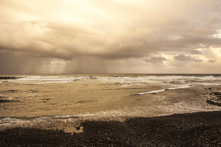 stormy weather on the ocean, rain over the seaの写真素材