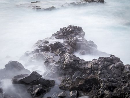 Seascape, waves in a long exposure, sea and rocks in the evening,の写真素材