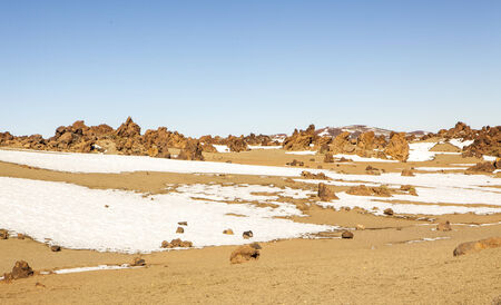 beautiful scenic view of the teide national park desert with snow in tenerifeの写真素材