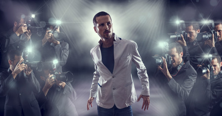Portrait of attractive male vip celebrity posing in front of photographers paparazzi Portrait of attractive male vip celebrity posing in front of photographers paparazzi
