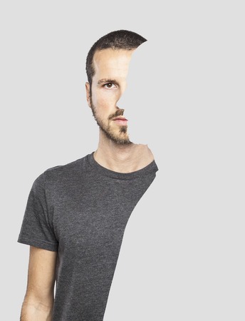 surrealistic portrait of a young man with cut out profileの写真素材