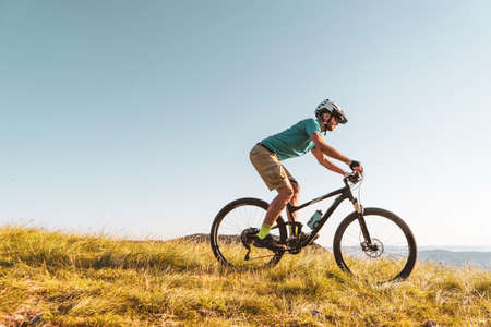 Man riding his mountain bike outdoor in natureの写真素材
