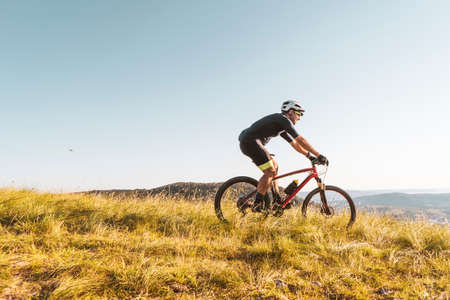Man riding his mountain bike outdoor in natureの写真素材