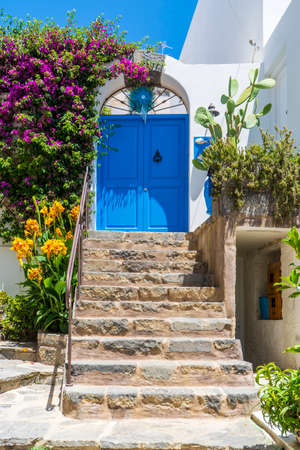 Beautiful front door with flowers of a house in Ischia island, italyの写真素材