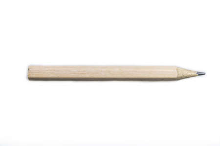 a brown colored pencil, in a horizontal position, positioned on a white backgroundの写真素材