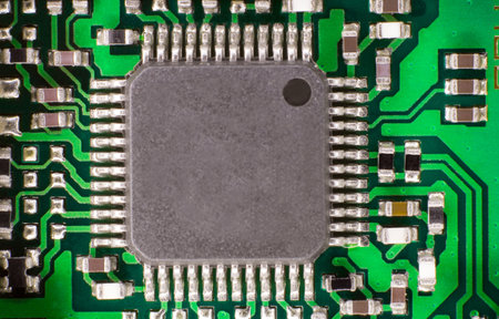 The macro photo of an electronic processor, positioned in the center of an electrical circuit that...