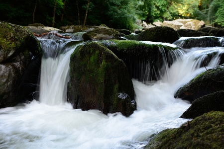 Long exposure of a waterfall in a fresh mountain stream
