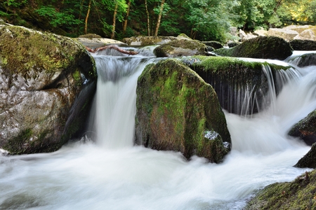 Long exposure of a waterfall at Watersmeet in Devonの写真素材