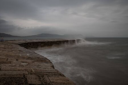 Long exposure of Lyme Regis pier in Dorsetの写真素材