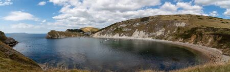 Panoramic photo of Lulworth cove in Dorsetの写真素材
