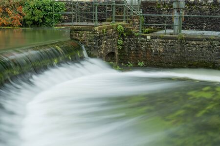 Long exposure of a waterfall in Cheddar village in Somersetの写真素材