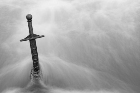 Close up of the sword in the stone in the Cheddar Yeo in Cheddar in Somerset.の写真素材