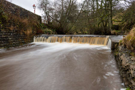 Long exposure of the wtarfall on the Eller Beck river flowing past Goathland train stationの写真素材