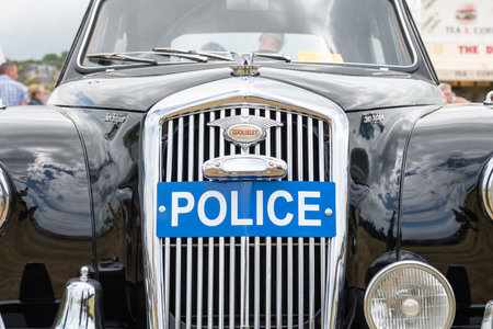 West Bay.Dorset.United Kingdom.June 12th 2022.A vintage Wolseley police car is on display at the West Bay vintage rallyのeditorial素材
