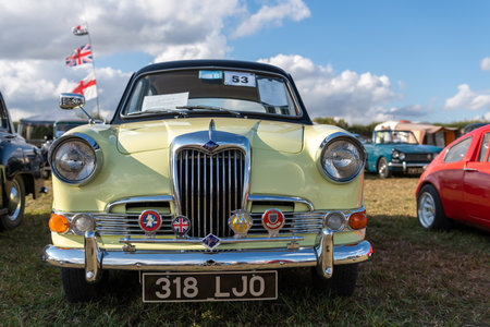 Tarrant Hinton.Dorset.United Kingdom.August 25th 2022.A yellow and black Riley one point five from 1961 is on display at the Great Dorset Steam Fairのeditorial素材
