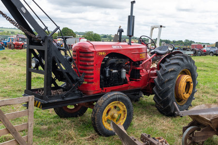 Low Ham.Somerset.United Kingdom.July 23rd 2023.A Massey Harris 744D with a mounted crane is on show at the Somerset steam and country showのeditorial素材