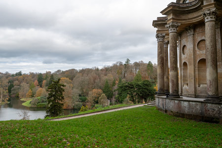 Photo of the last of the autumn colours at the Temple Of Apollo in Stourhead Gardens.の写真素材