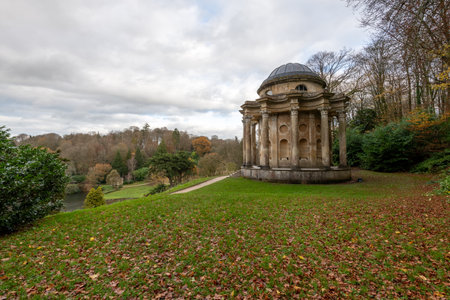 Photo of the last of the autumn colours at the Temple Of Apollo in Stourhead Gardens.の写真素材