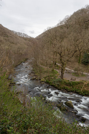 Long exposure of the East Lyn river flowing through Watersmeet Valley In Exmoor National Parkの写真素材