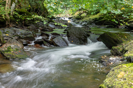 Long exposure of a waterfall on the East Lyn river at Watersmeet In Exmoor National Parkの写真素材