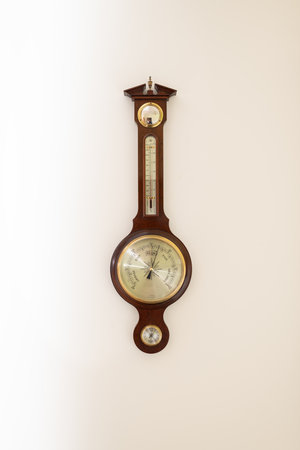 Close up of an aneroid barometer mounted on a wallの写真素材