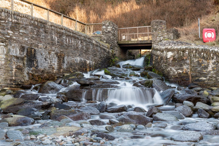 Long exposure of a waterfall flowing onto Lee Abbey Beach in Devonの写真素材