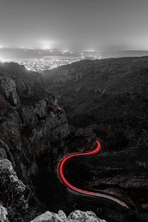 Night photo of light trails at the horseshoe bend at Cheddar gorge in Somersetの写真素材