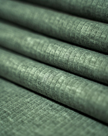 Background texture of green fabric. Close-up, selective focus.の写真素材