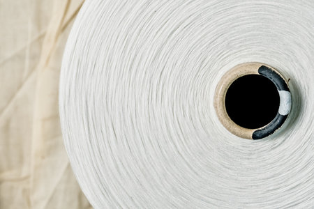 Roll of white paper on fabric background, top view, copy spaceの写真素材