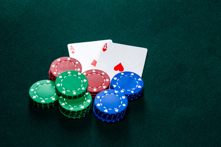 Poker play. Chips and cards on the green tableの写真素材