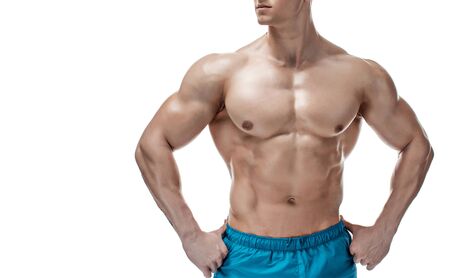 Strong Athletic Man showing muscular body and sixpack abs isolated on white backgroundの写真素材