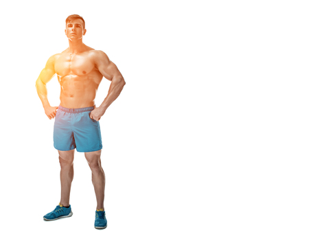 Strong Athletic Man showing muscular body and sixpack abs isolated on white background. full-length, copyspaceの写真素材