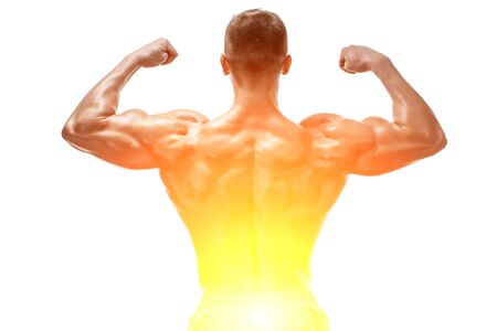 Strong Athletic Man showing muscular body and sixpack abs isolated on white background. with sun flareの写真素材