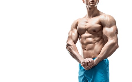 Strong Athletic Man showing muscular body and sixpack abs isolated white background. Close up, copyspaceの写真素材