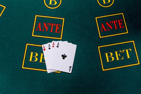 Poker chips on a poker table at the casino. Closeup. four aces, a winning combination.の写真素材