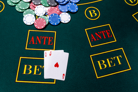 Poker chips on a poker table at the casino. Closeup. two aces, a winning combination. Chips winnerの写真素材