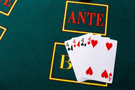 Poker chips on a poker table at the casino. Closeup. quads, a winning combination.の写真素材
